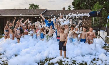 Group of kids in foam at a foam party