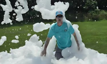 Adult enjoying foam at a foam party