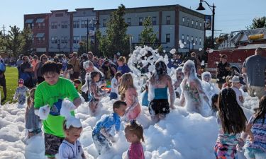 Group of kids jumping in foam