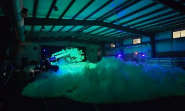 Indoor foam party with green lights