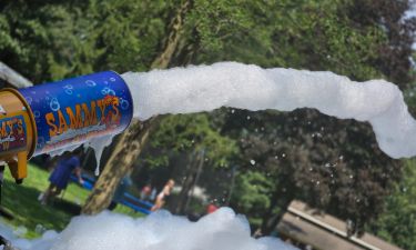 Kids enjoying foam under the sun