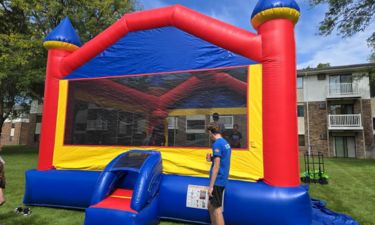 Kids jumping inside a bounce house