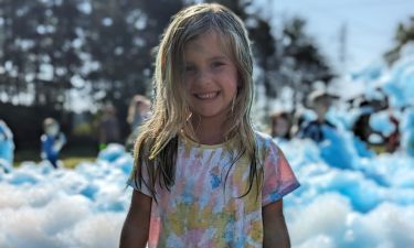 Kids laughing and playing in foam