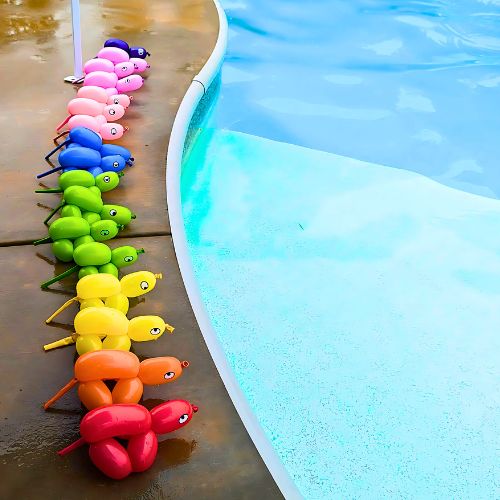 twisted balloon animals layed by a pool for a birthday party by our Balloon Twisting experts.