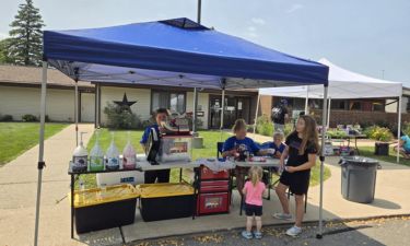 snow caone and Cotton candy stand with family at an event