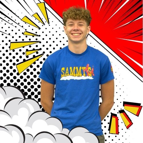 Team member wearing a blue Sammy's shirt, standing in front of a comic-style background with red, yellow, and black bursts.