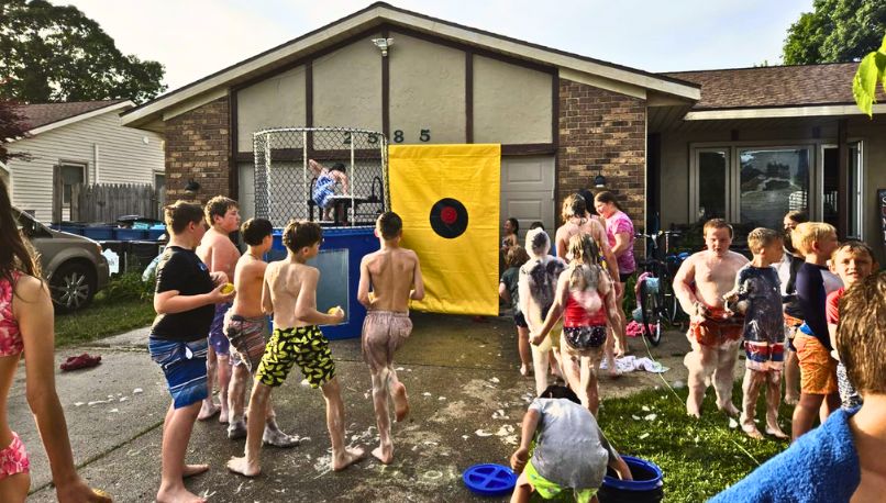 Kids enjoying a fun dunk tank experience at a Sammy's Party on Wheels events.