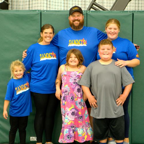 The Ballou family representing Sammy's Party on Wheels events in matching blue t-shirts, ready to bring fun to your next event.