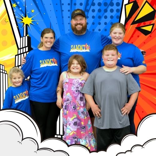 Contact Us! The Ballou family posing together in Sammy's Party on Wheels shirts against a colorful comic-style background.