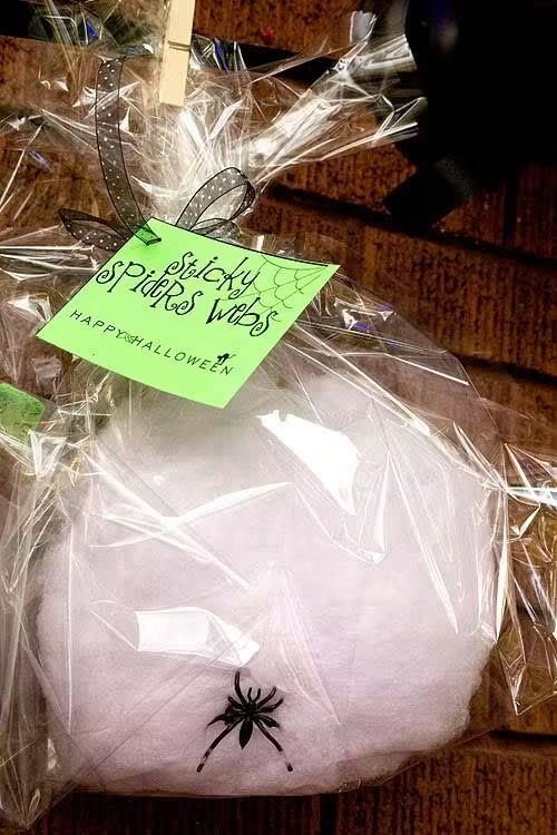 Not-So-Spooky Halloween Party Ideas Your Kids Will Actually Love 1 Pre-bagged Spooky Spider Webs cotton candy with a plastic spider for Halloween